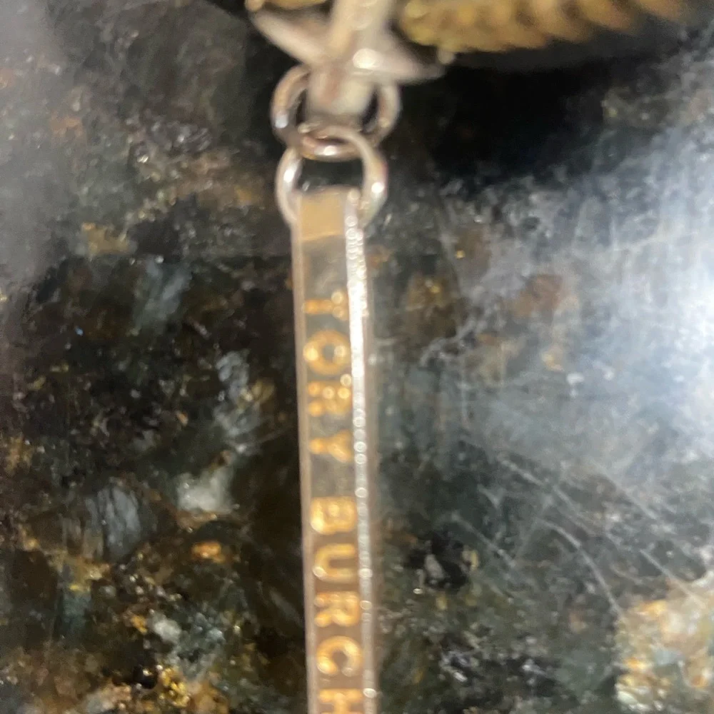 Tory Burch Black and Gold Logo Tassel Charm
